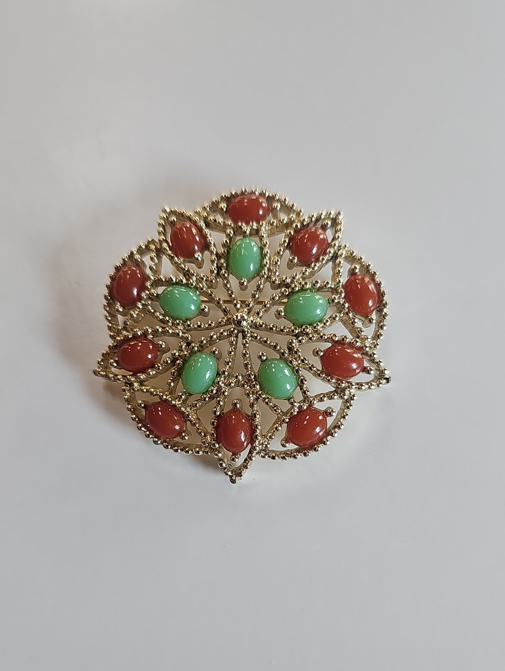 Gold-Tone Floral Brooch with Green and Red Cabochons
